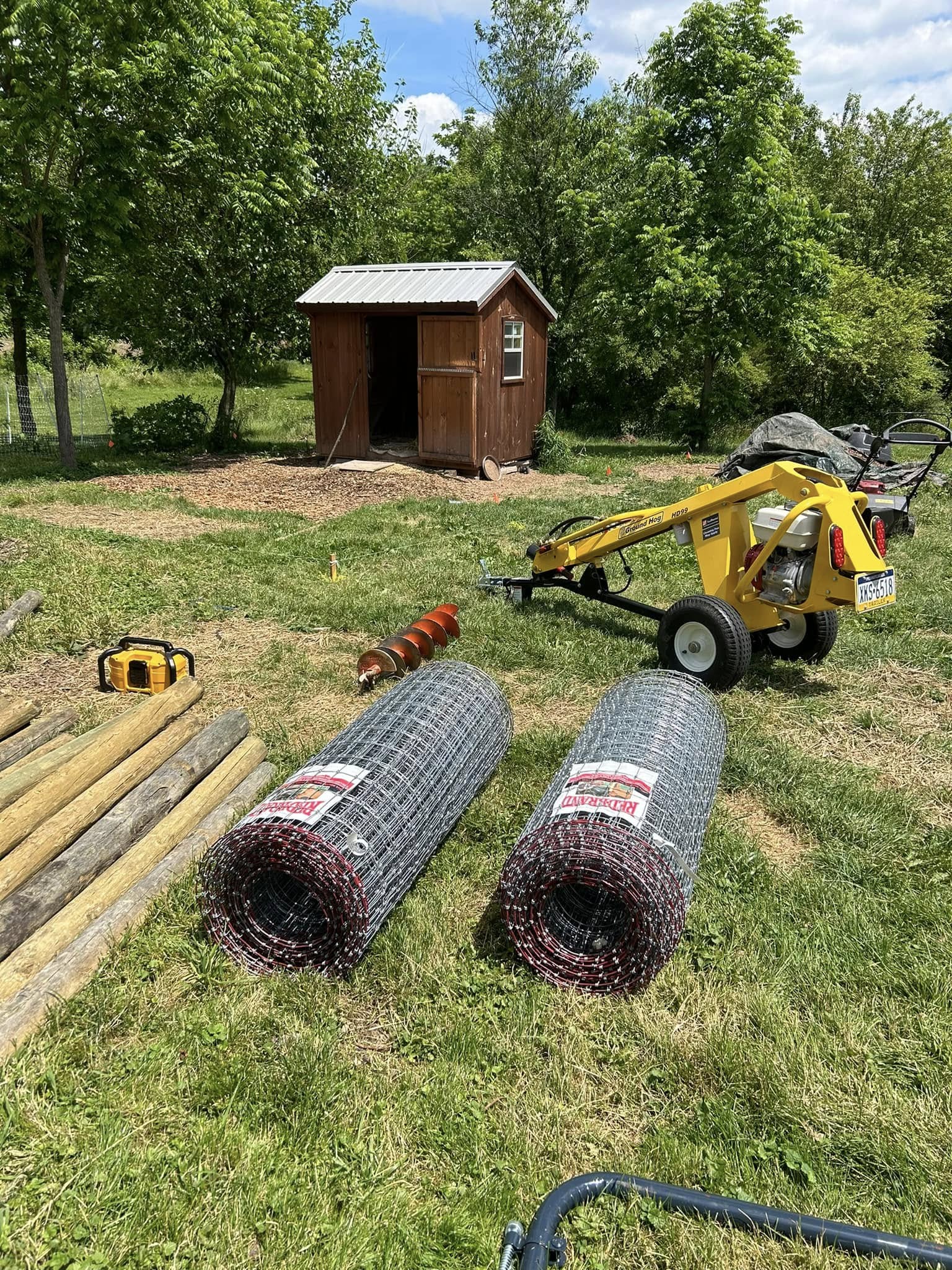 Working on a fence post